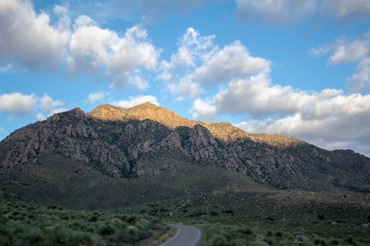 The sun dancing down the Organ Mountains-Desert Peaks as the sun rises into the sky.