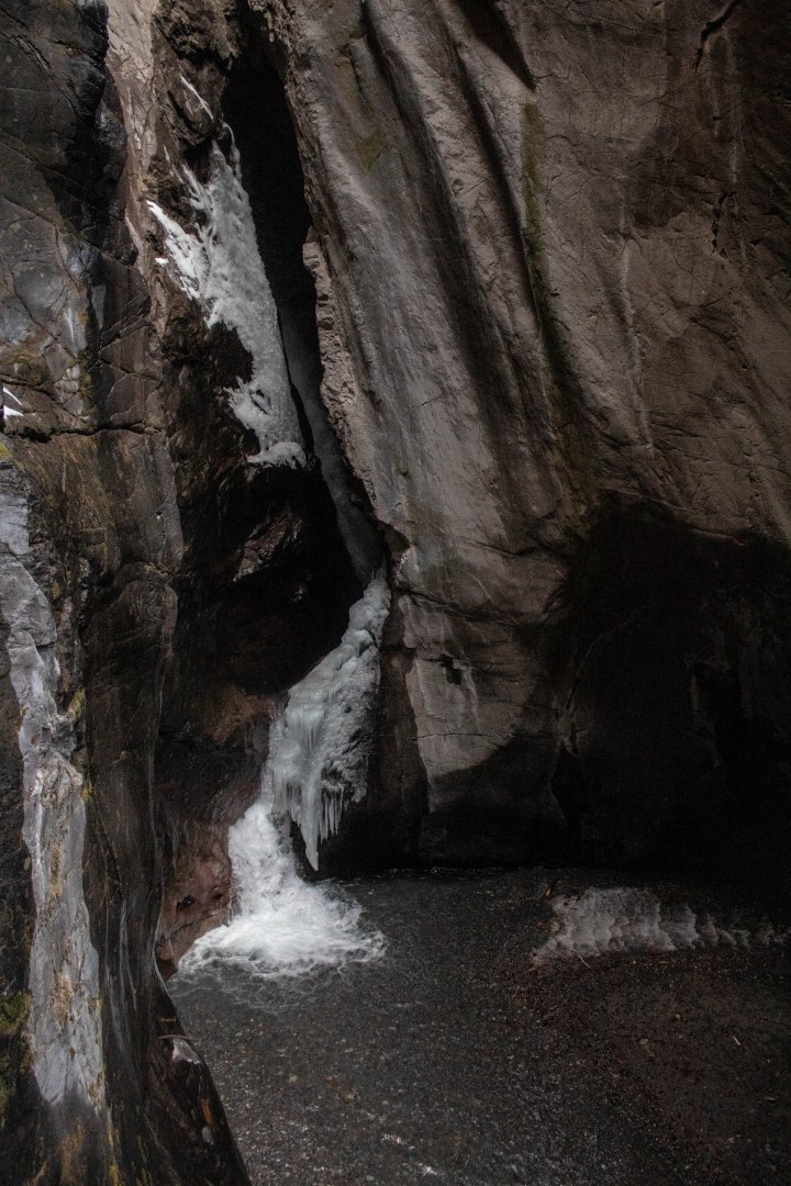 Inside the canyon flows an icy waterfall.