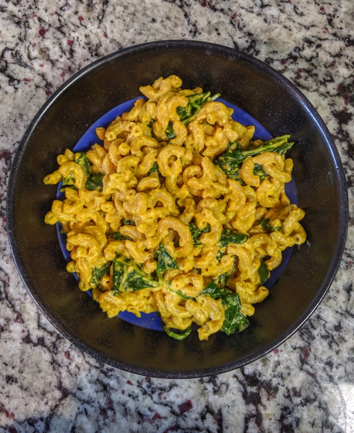 Colorful vegan spinach mac n’ cheese.
