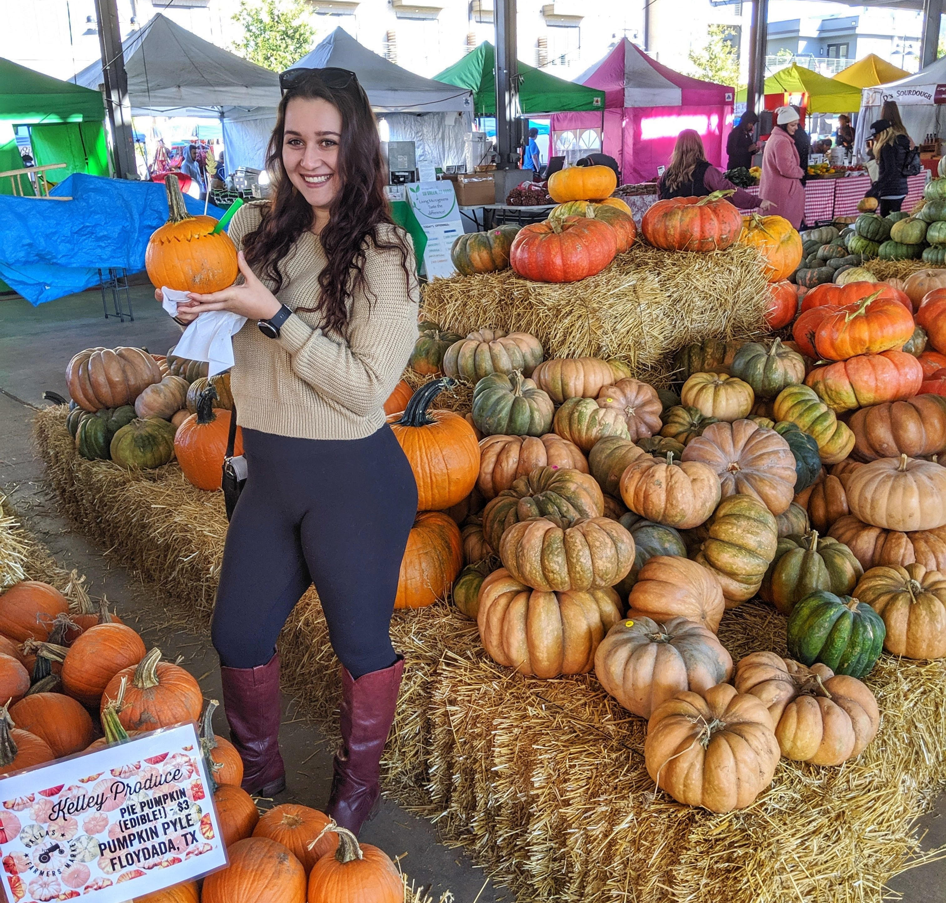 Enjoying an apple-spiced pumpkin drink at the Dallas Farmers Market.